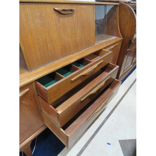 896 - Mid 20th Century Teak Sideboard. Central bank of three graduated drawers, Illuminated central top cu... 