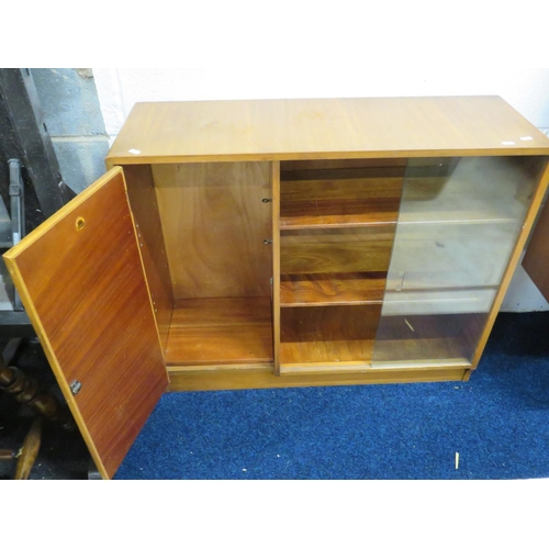 897 - Mid 20th Century Teak Book case with twin glass sliding doors and cupboard to side by Castle Furnish... 