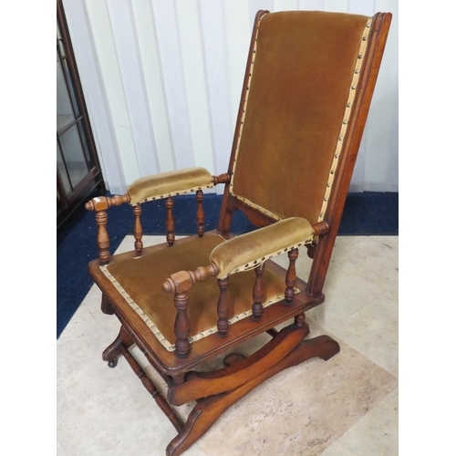 909 - Oak made American sprung rocker with mustard coloured upholstery. Excellent condition with no work n... 