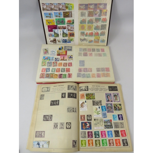 642 - 3 small stamp albums of various world stamps.