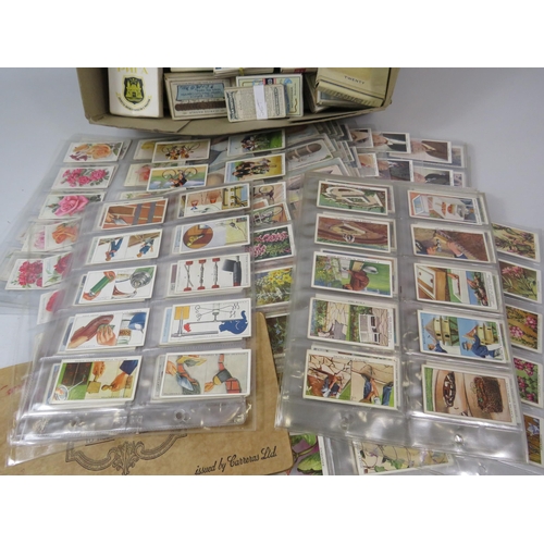 653 - Large selection of cigarette cards in original packets and 12 complete sets in sleeves.