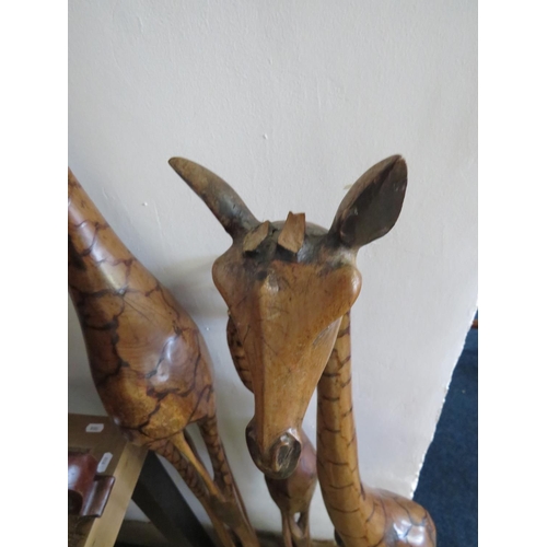 934 - Family of African Hardwood Giraffes. Each has damage to horns. Tallest 64 inches tall. See photos. S... 