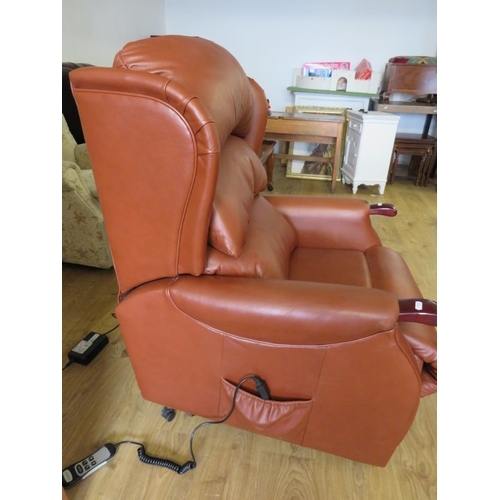 940 - Very Comfortable Single motor electric Rise/Recline armchair.  Soft brown leather, slight rubbing to... 