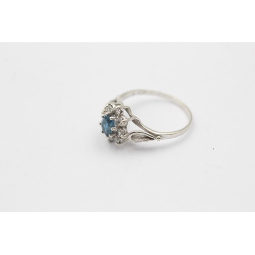 324 - 9ct white gold topaz & clear gemstone halo ring (1.7g)     737620 Finger Size 'K'