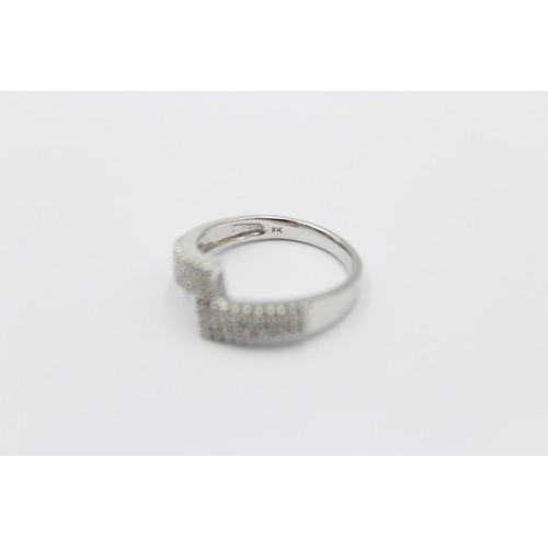 338 - 9ct white gold diamond bypass ring (3g)     788873
Finger Size'O'