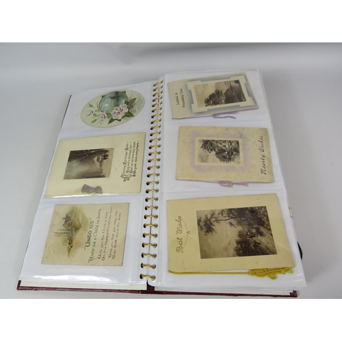 689 - Album of vintage greeting cards, silks, boomarks etc.