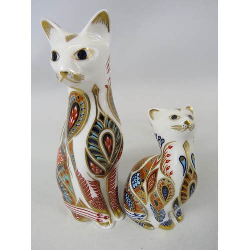 720 - Royal crown derby siamese cat and kitten paperweights with gold stoppers.