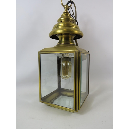 756 - Polished brass outdoor lantern light fitting with bevel edge glass panels.