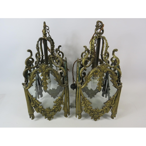 757 - Pair of heavy brass ornate light fittings with glass panels. 17.5