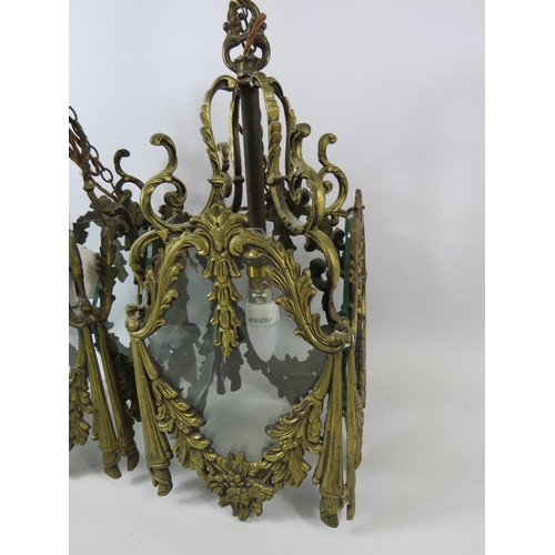 757 - Pair of heavy brass ornate light fittings with glass panels. 17.5