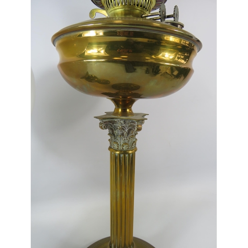 762 - 2 Vintage brass oil lamps with white Globe shades.