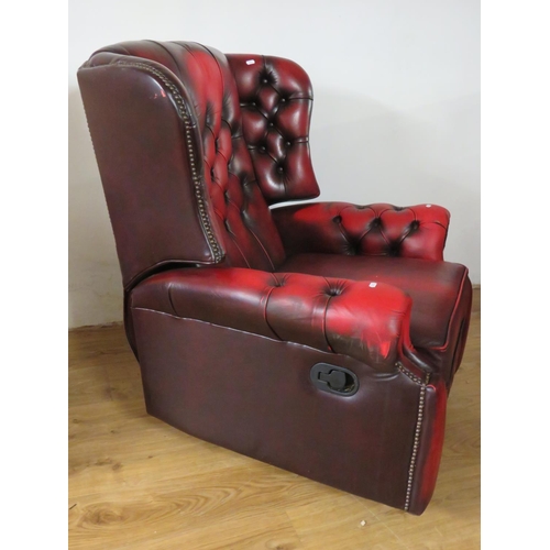 942 - Leather Chesterfield Wing back Armchair manual recliner in Oxblood . Minor scuff/wear to left hand s... 