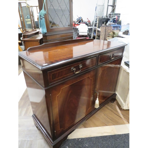 1003 - Reproduction Mahogany Cupboard with two drawers over. Decorative stringing, locks work, keys present... 