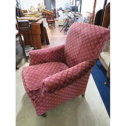 997 - Nicely Upholsered Club chair with castors to front legs. Good condition.(Barn) See photos. S2