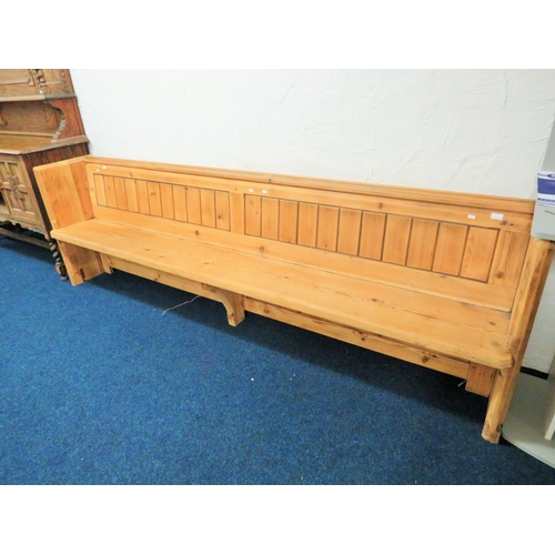 953 - Long and well constucted pine pew with fitted plate rack to rear. H:33 x W:107 x D:20 Inches. See ph... 