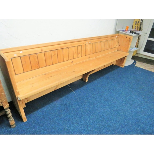 953 - Long and well constucted pine pew with fitted plate rack to rear. H:33 x W:107 x D:20 Inches. See ph... 