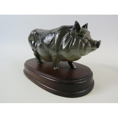 1 - 2 Royal Doulton pig figurines standing on wooden bases. Vietnamese pot belly and Tamworth.