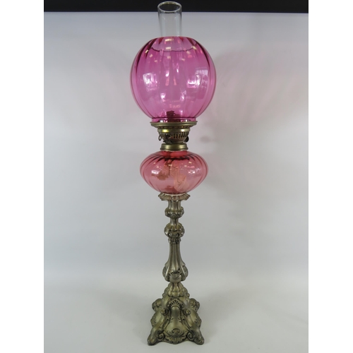 39 - Very tall cranberry glass oil lamp approx 31