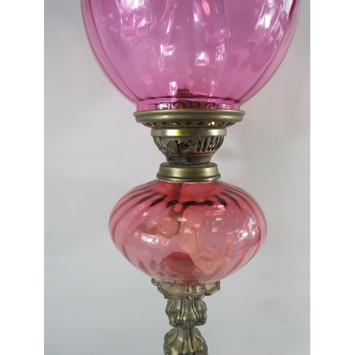 39 - Very tall cranberry glass oil lamp approx 31