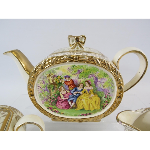 62 - Sadler barrel teapot, sugar bowl and milk jug with a courting couple scene.