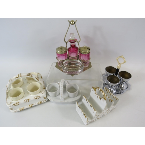 94 - Vintage cruet set, egg cruets and a toast rack.