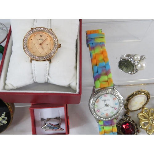 124 - Good Selection of costume jewellery to include two ladies quartz watches, one boxed. Plus a Mackinto... 