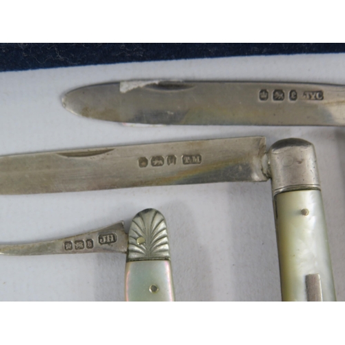 114 - 6 Sterling silver penknives with MOP handles plus a button hook and a fish knife.