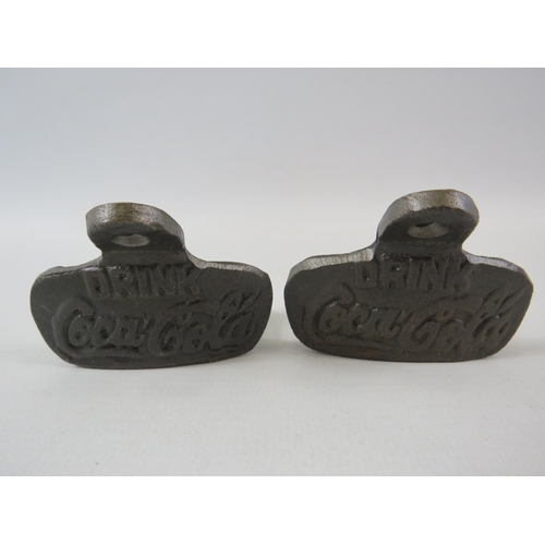 306 - 2 cast metal Coca cola bottle openers.