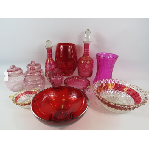 298 - Large selection of  art deco, carnival, cranberry, red & pink art glass, decanters , vases etc.