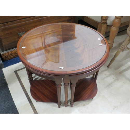 626 - Handy, Darkwood glass topped circular low table with four segmented sub tables all with glass tops. ... 