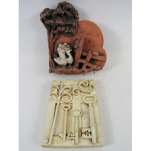 310 - A pottery wall plaque key holder and a wall plaque tile with key decoration.