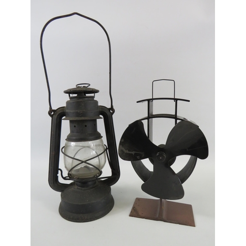 313 - Vintage storm lantern and a stove fire fan.