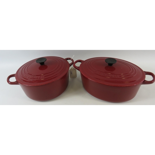 318 - 2 Large lidded Le Creuset casserole pans.