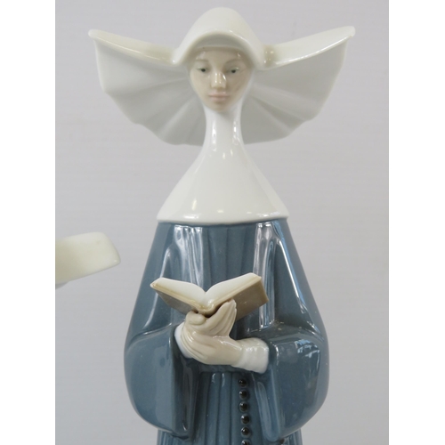 325 - 2 Lladro nun figurines. The tallest measures 10