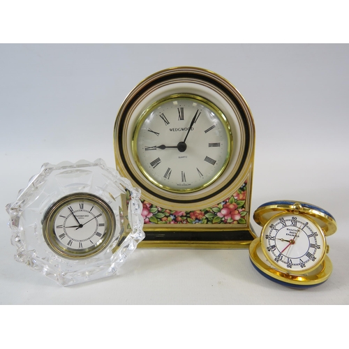 327 - Halcyon days enamel travel clock, Wedgwood Clio mantle clock and a Waterford crystal clock.