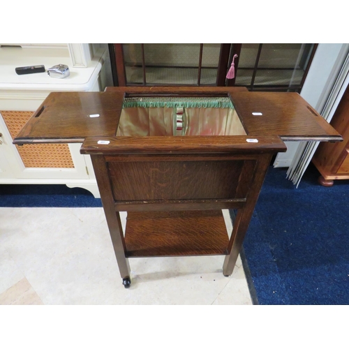 657 - Early 20th Century Dark Oak Sewing or Craft trolley on original castors with shelf under main body. ... 