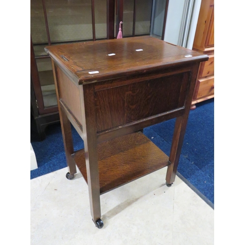 657 - Early 20th Century Dark Oak Sewing or Craft trolley on original castors with shelf under main body. ... 