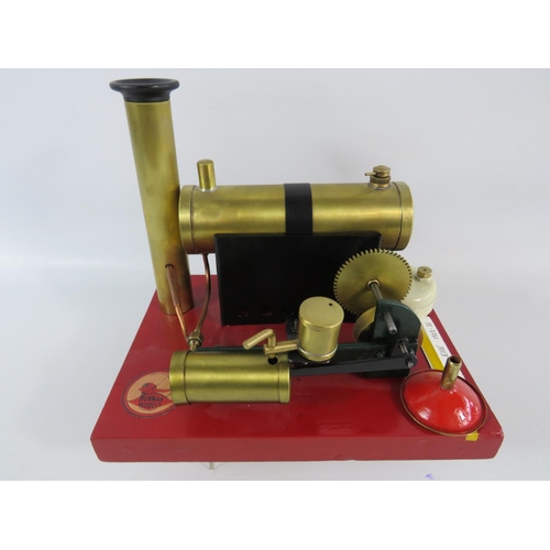 54 - 1922-1935 Bowmans Stationary Steam Engine model E135. Set on a wooden block it measures 7 x 9 inches... 