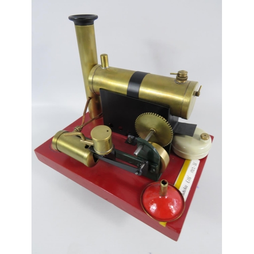 54 - 1922-1935 Bowmans Stationary Steam Engine model E135. Set on a wooden block it measures 7 x 9 inches... 