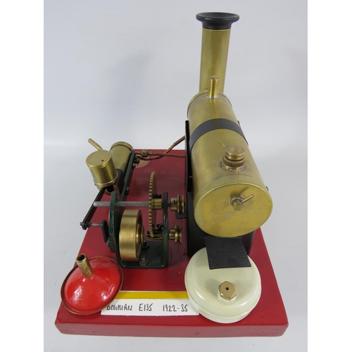 54 - 1922-1935 Bowmans Stationary Steam Engine model E135. Set on a wooden block it measures 7 x 9 inches... 