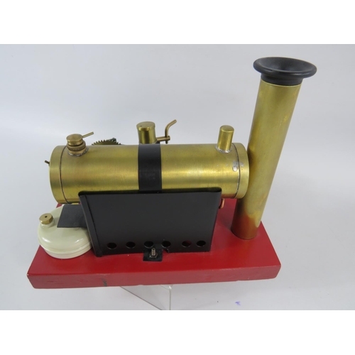 54 - 1922-1935 Bowmans Stationary Steam Engine model E135. Set on a wooden block it measures 7 x 9 inches... 