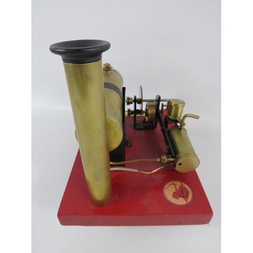 54 - 1922-1935 Bowmans Stationary Steam Engine model E135. Set on a wooden block it measures 7 x 9 inches... 