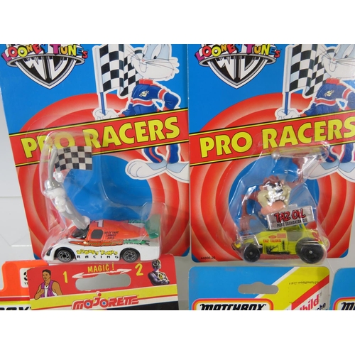 108 - Two Matchbox Looney tunes Pro Racer models in Blister packs, plus other Matchbox cars unused in Blis... 