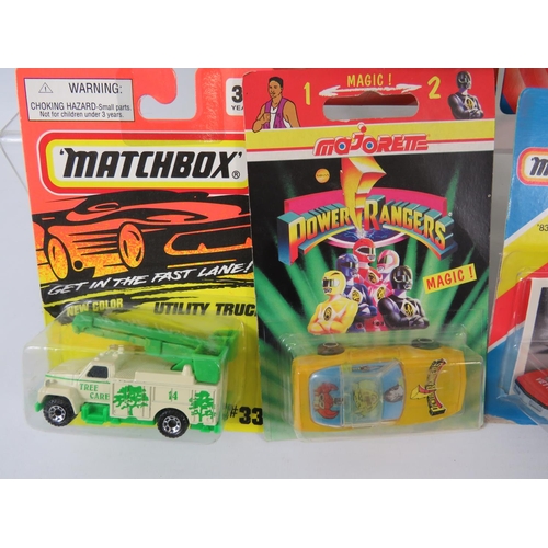 108 - Two Matchbox Looney tunes Pro Racer models in Blister packs, plus other Matchbox cars unused in Blis... 