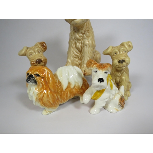 221 - 4 Sylvac terriers and a pekingese dog figurines.