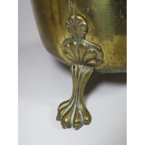 246 - Large brass log bucket with 3 claw feet and lion head handles, 11.5