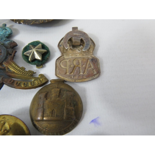 179 - Selection of Military items, Silver ARP Badge, Cap badges, buttons, shell cases etc. see photos.