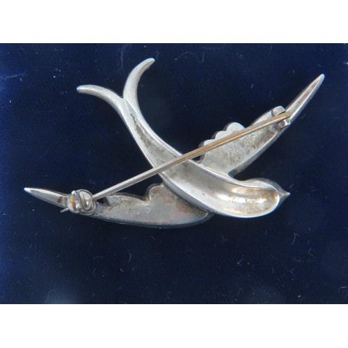 190 - 925 Sterling Silver Diamante encrusted Brooch as a diving swallow, 70mm width. Comes with silk and v... 