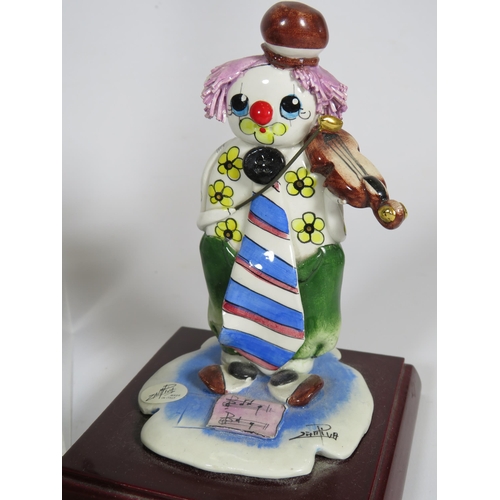 657 - 7 Italian pottery Zampiva clown figurines. The tallest measures 18.5cm