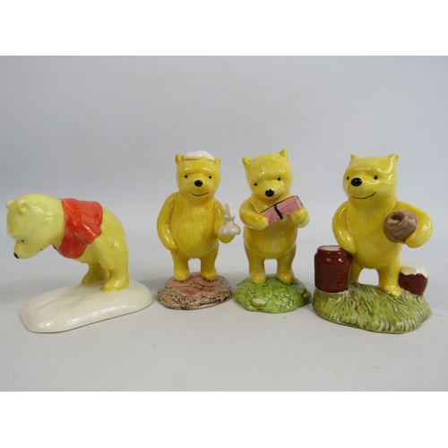 86 - 4 Royal Doulton Winnie the Pooh figurines.